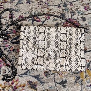 White and grey snakeskin faux leather crossbody.